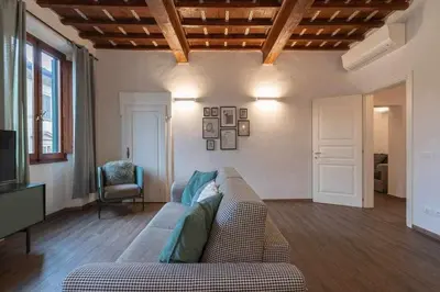 Area soggiorno di Elegant Green Apartment In San Gallo Firenze