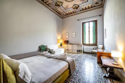 Letto o letti in una camera di Roommo D'Azeglio