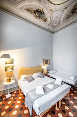 Letto o letti in una camera di Roommo D'Azeglio