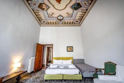 Letto o letti in una camera di Roommo D'Azeglio