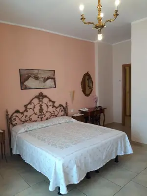 Letto o letti in una camera di La casa di Catia