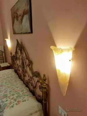 Letto o letti in una camera di La casa di Catia