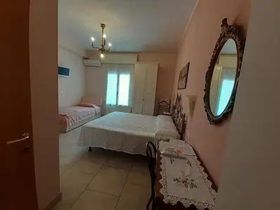 Letto o letti in una camera di La casa di Catia