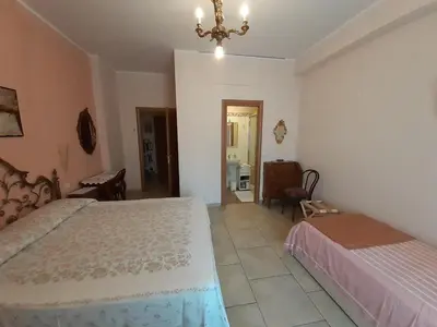 Letto o letti in una camera di La casa di Catia