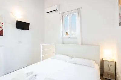 Letto o letti in una camera di GuestHost - Palazzo Medici Apartments