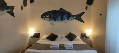 Letto o letti in una camera di Street Art Inn Florence