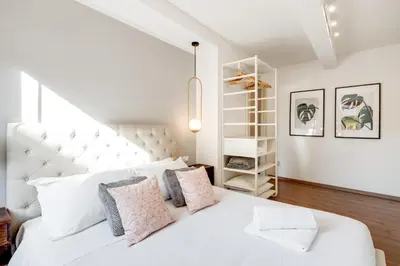 Letto o letti in una camera di GuestHost - Cozy Gem in Santa Croce