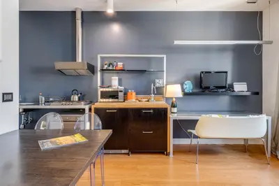 Cucina o angolo cottura di GuestHost - Piazza Santa Croce Design Apartment with Balcony