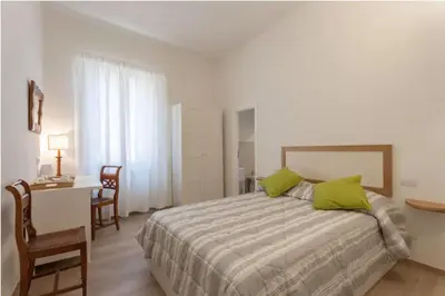 Letto o letti in una camera di Santo Spirito Boutique Apartments
