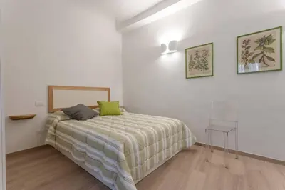 Letto o letti in una camera di Santo Spirito Boutique Apartments