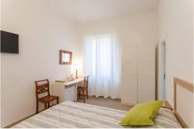 Letto o letti in una camera di Santo Spirito Boutique Apartments
