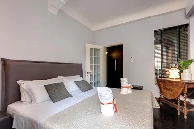 Letto o letti in una camera di San Niccolò Apartment by Mamo Florence