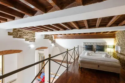 Letto o letti in una camera di GuestHost - Palazzo Pitti Apartment with Terrace