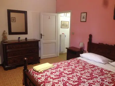 Letto o letti in una camera di LA BARRIERA affittacamere
