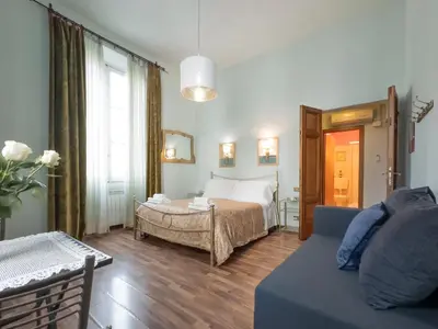 Letto o letti in una camera di Affittacamere Firenze in Libertà Parterre