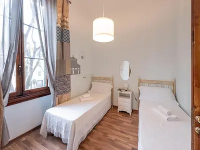 Letto o letti in una camera di Affittacamere Firenze in Libertà Parterre
