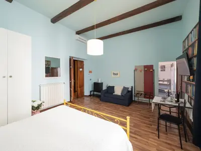 Letto o letti in una camera di Affittacamere Firenze in Libertà Parterre