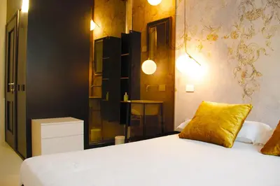 Letto o letti in una camera di Colorful Pied-à-Terre _ Via Gioberti