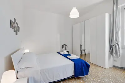 Letto o letti in una camera di GuestHost - Lulli Cozy Apartment with Balcony