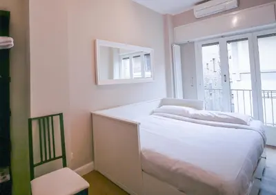 Letto o letti in una camera di Apartments Florence- Palazzo Pitti