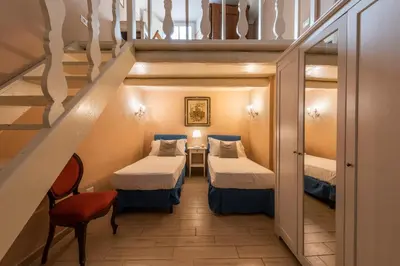 Letto o letti in una camera di Apartments Florence- Palazzo Pitti
