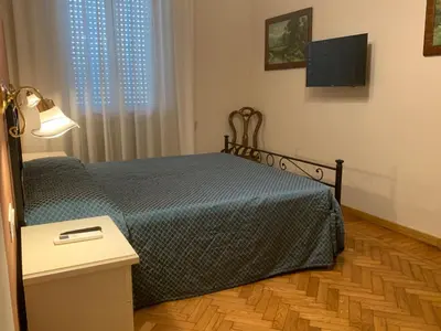 Letto o letti in una camera di Donatello Apartment