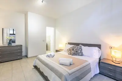 Letto o letti in una camera di Duomo Confort Suite