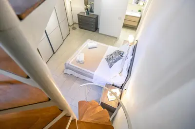 Letto o letti in una camera di Duomo Confort Suite