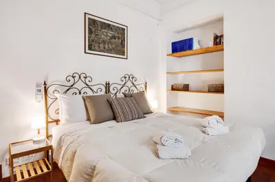 Letto o letti in una camera di GuestHost - Porta Rossa Apartments near Ponte Vecchio