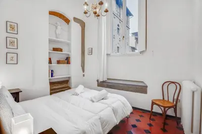 Letto o letti in una camera di GuestHost - Porta Rossa Apartments near Ponte Vecchio