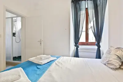 Letto o letti in una camera di GuestHost - Parioncino Central and Cozy Apartment