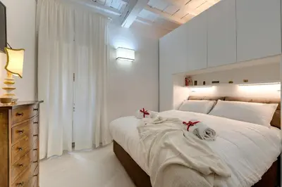 Letto o letti in una camera di Brancacci Suite by Mamo Florence