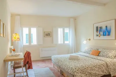 Letto o letti in una camera di Cozy Macci flat 4 people near Santa Croce Square