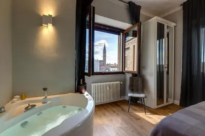 Letto o letti in una camera di Sleep Tight Florence Suite