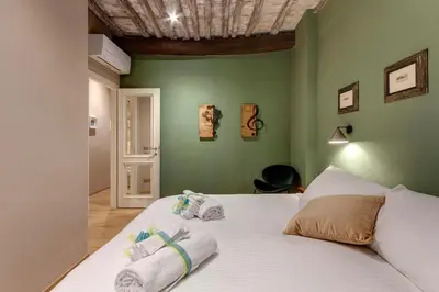 Letto o letti in una camera di Santa Croce Loft by Mamo Florence