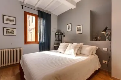 Letto o letti in una camera di San Marco Apartment by Mamo Florence
