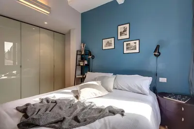 Letto o letti in una camera di San Marco Apartment by Mamo Florence