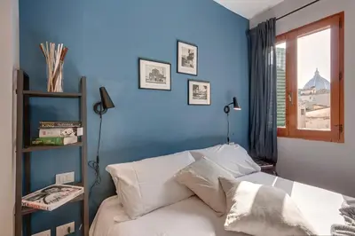 Letto o letti in una camera di San Marco Apartment by Mamo Florence