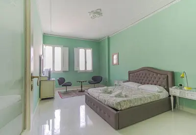 Letto o letti in una camera di Spacious Three Bedroom Apartment On the Arno