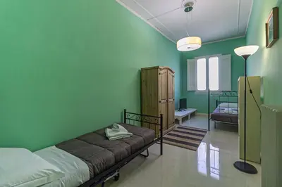 Letto o letti in una camera di Spacious Three Bedroom Apartment On the Arno