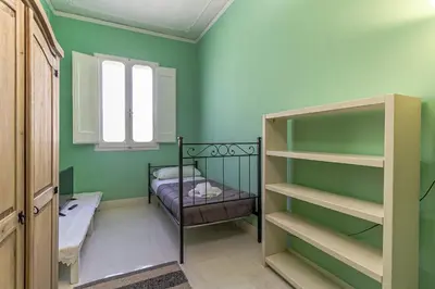 Letto o letti in una camera di Spacious Three Bedroom Apartment On the Arno