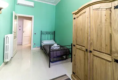 Letto o letti in una camera di Spacious Three Bedroom Apartment On the Arno