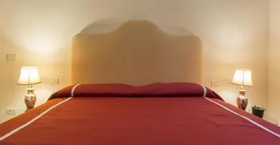 Letto o letti in una camera di VIlla Merlo Ner0