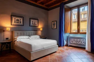 Letto o letti in una camera di Antica Dimora De' Benci