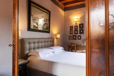 Letto o letti in una camera di Antica Dimora De' Benci