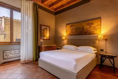 Letto o letti in una camera di Antica Dimora De' Benci