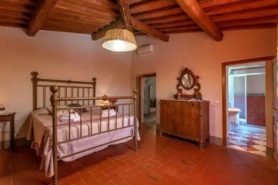 Letto o letti in una camera di Casale del Lago