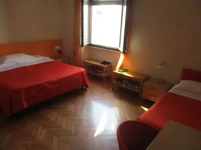 Letto o letti in una camera di Affittacamere ACCASA