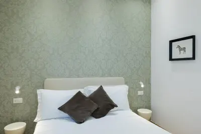 Letto o letti in una camera di Amabilia Florence