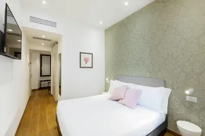 Letto o letti in una camera di Amabilia Florence